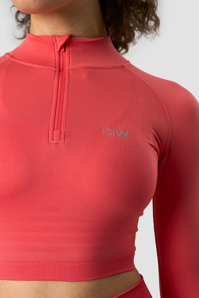 define cropped 1/4 zip coral